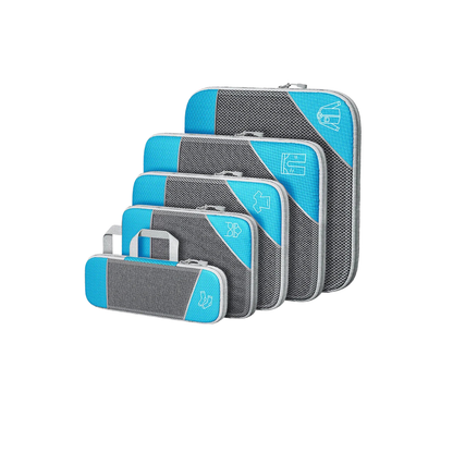 Set of gray and blue packing cubes on a white background