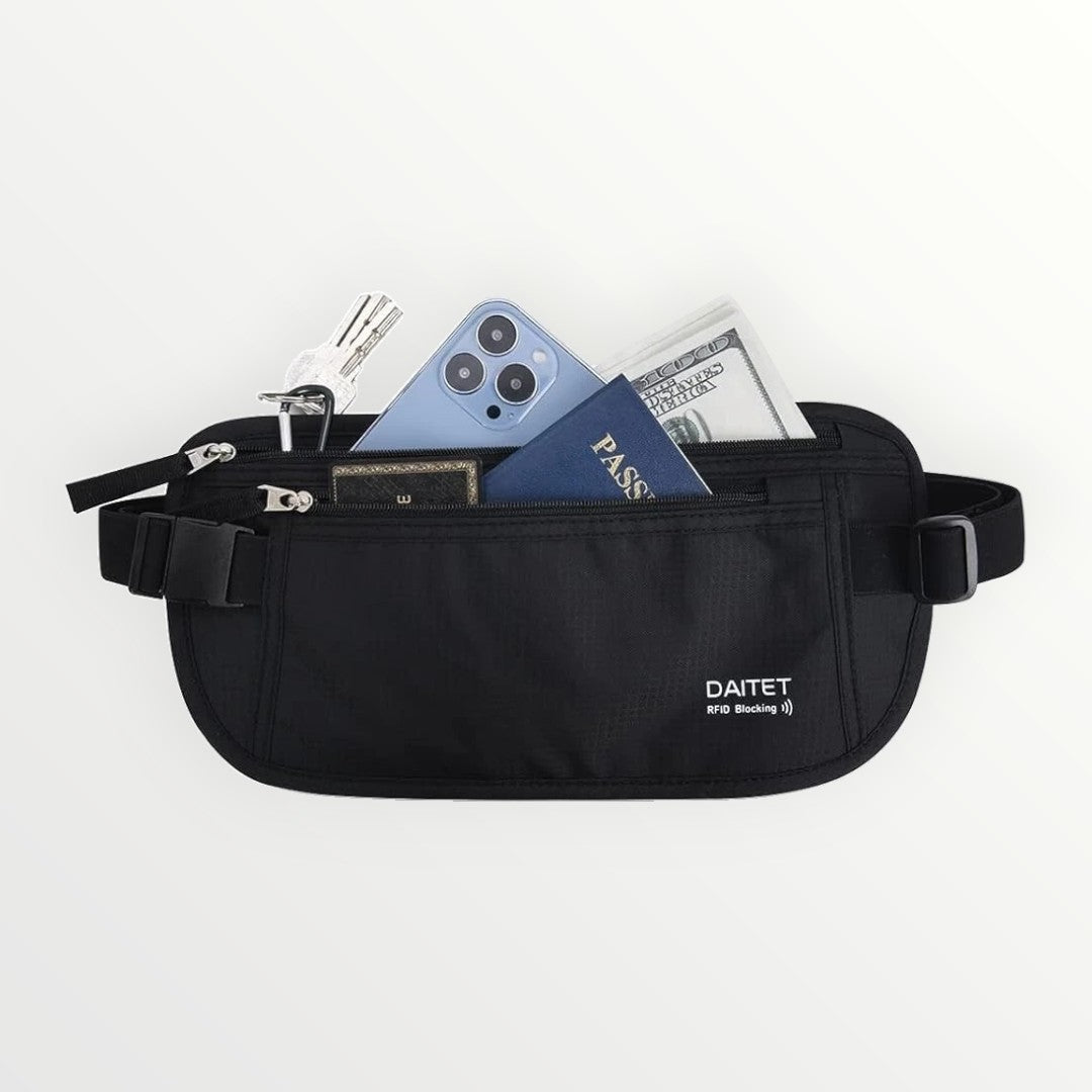 Black waist bag with items like a phone and money on a white background