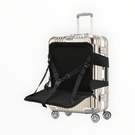 Silver suitcase with a black seat pad and straps on a white background